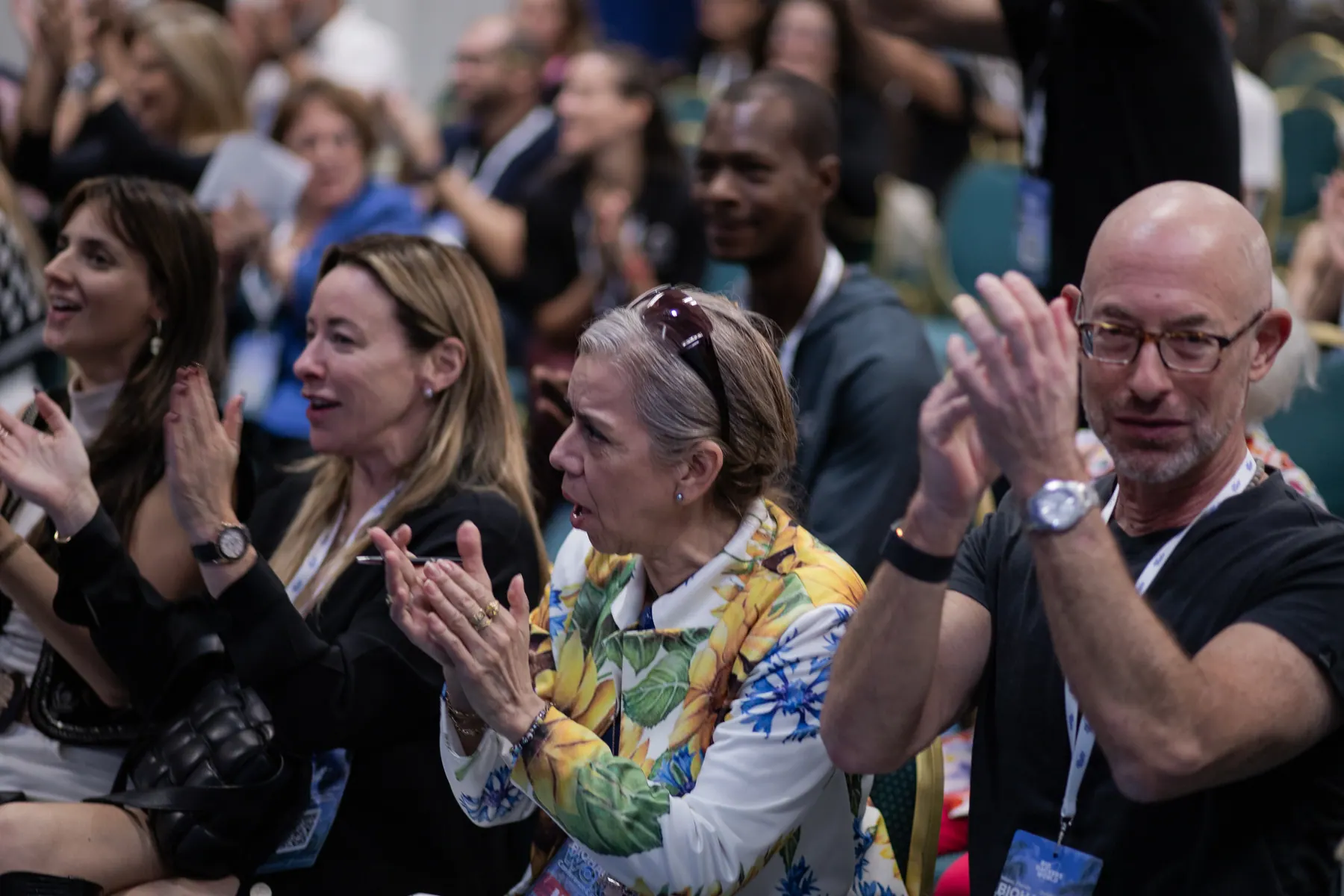 A conference audience applauding